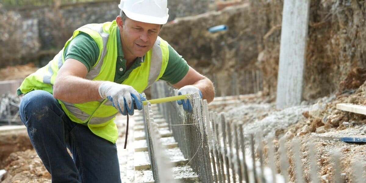 Builder Laying Foundation